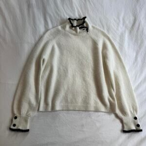 Sezane white sweater with black  trim and collar